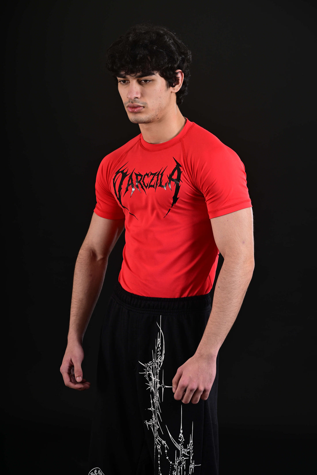 Men wearing red compression gym shirt Pakistan fitness brand