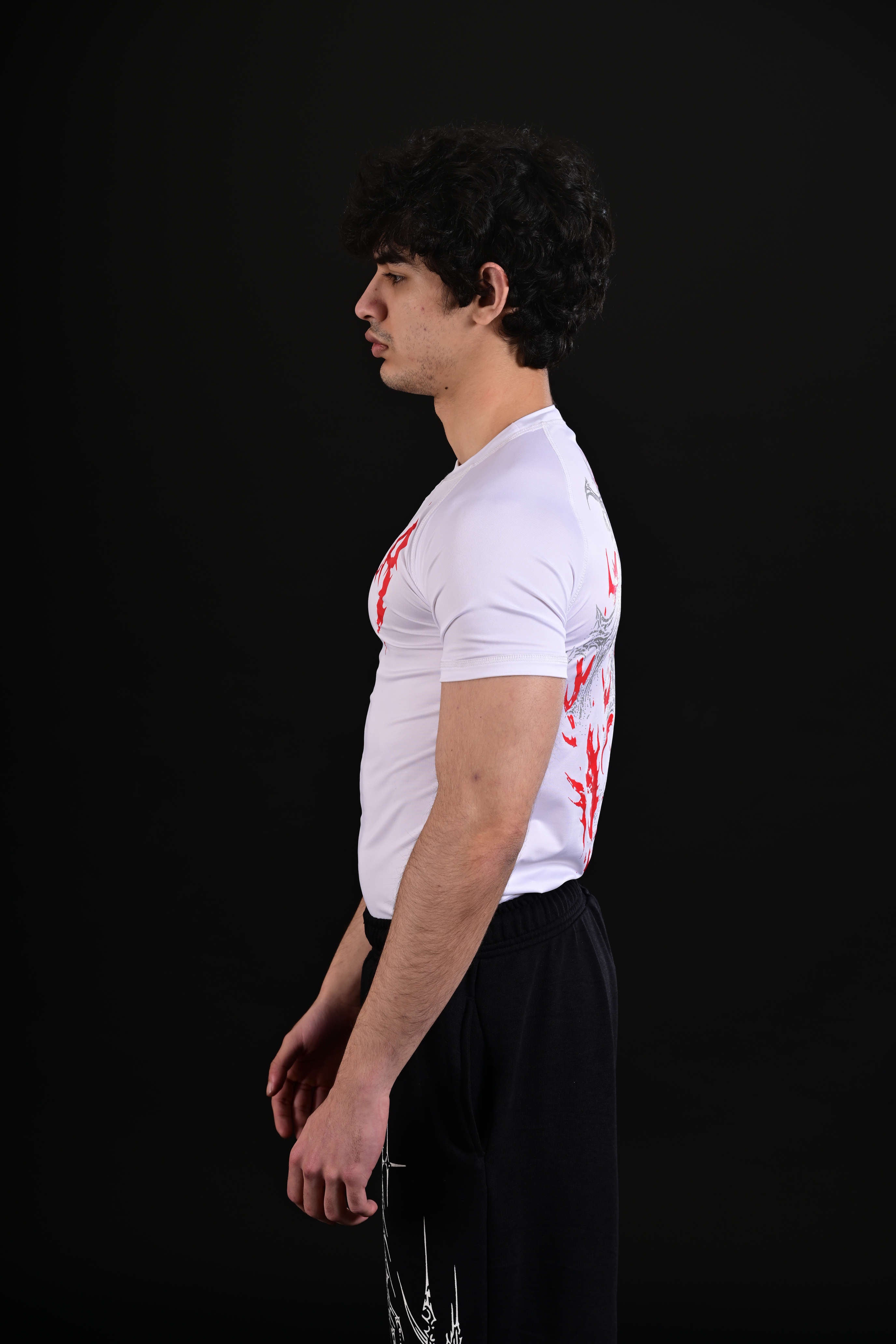 Back view of white half sleeve compression shirt for workouts