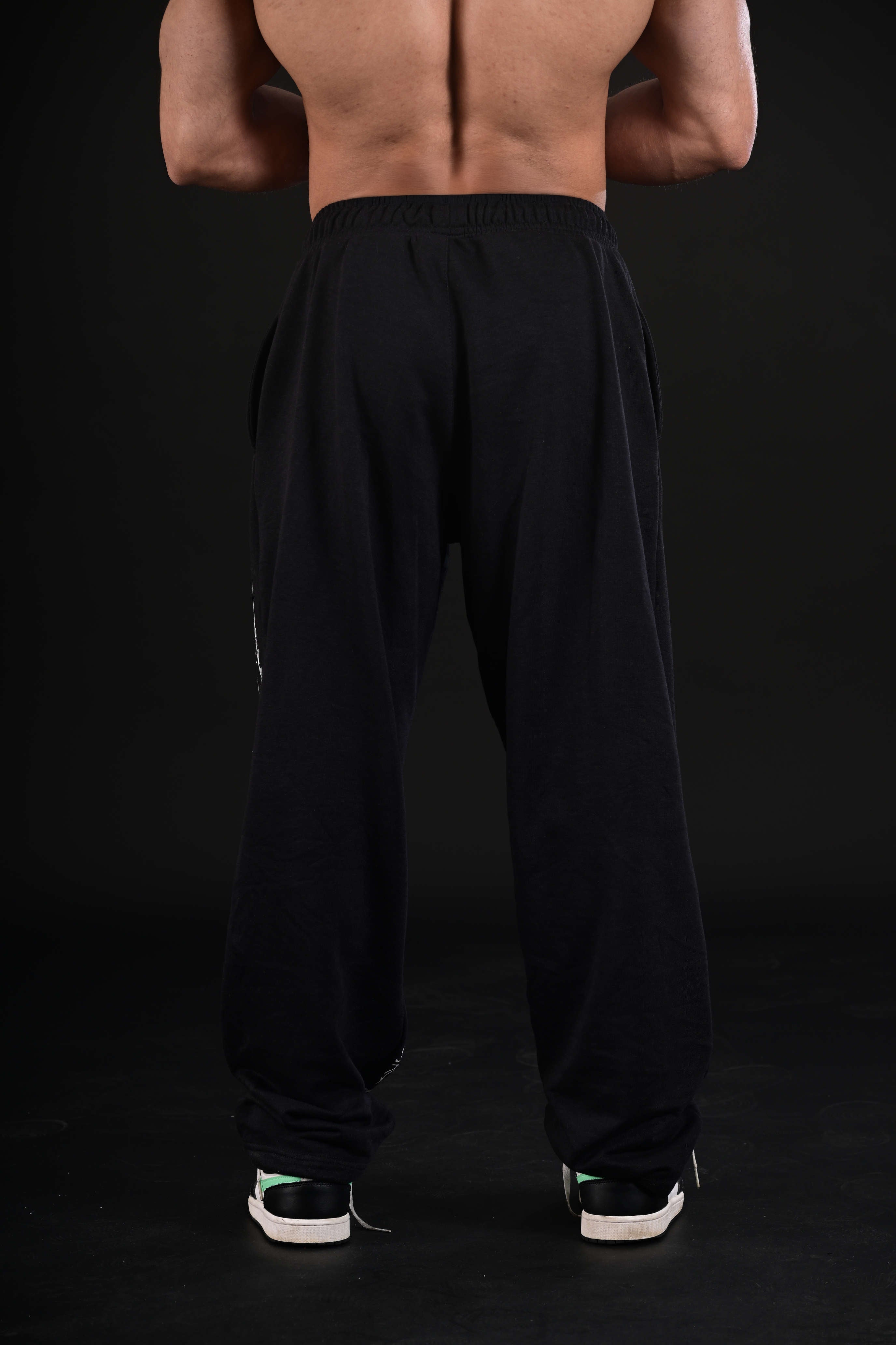 Women wearing black flare bottom activewear Pakistan
