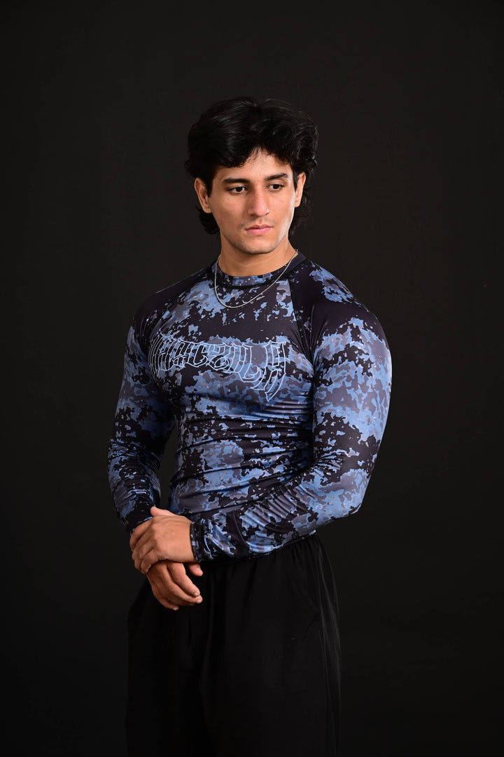 Blue compression activewear shirt designed for flexibility, breathability, and muscle support during workouts.