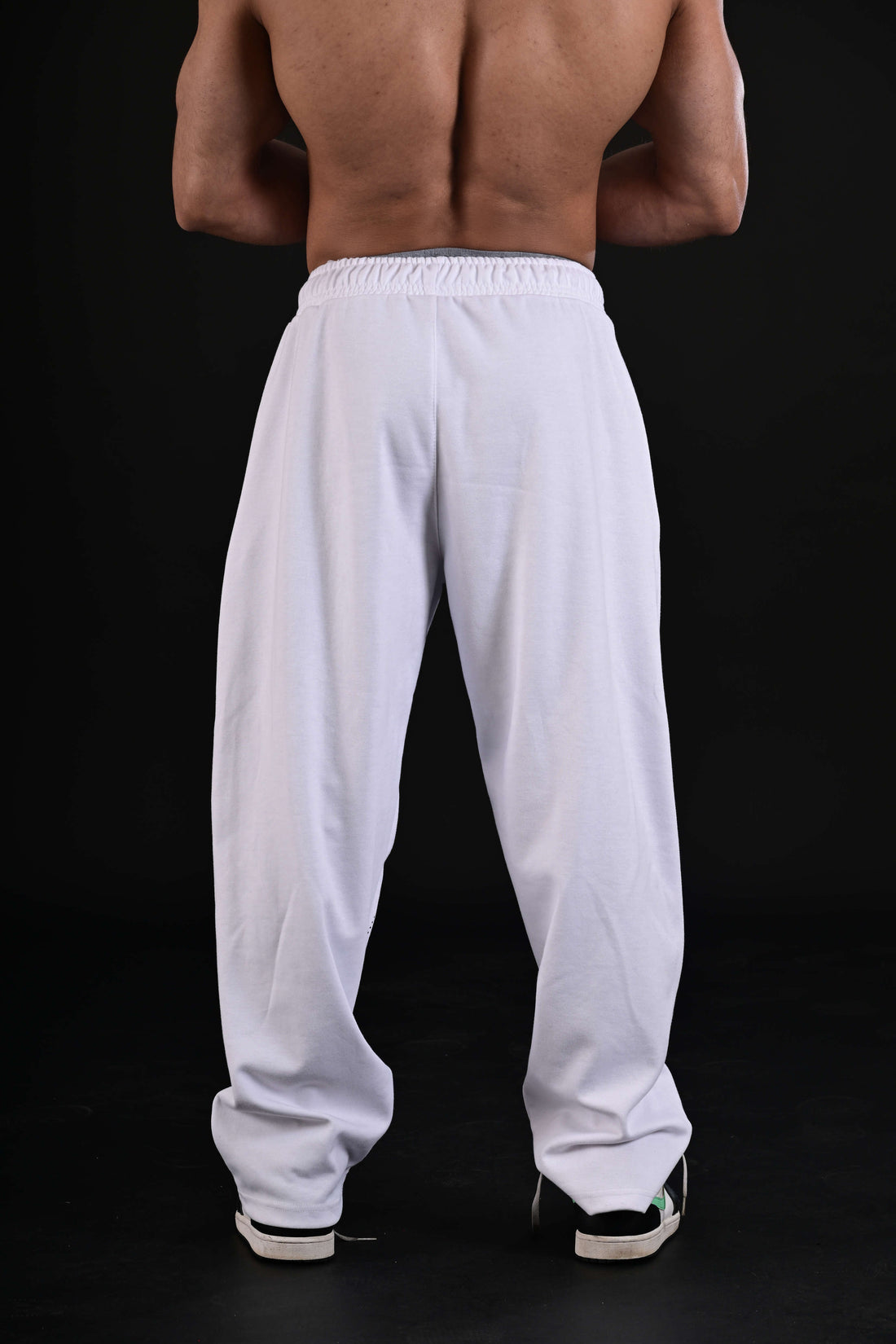 Women wearing white flare bottom activewear Pakistan