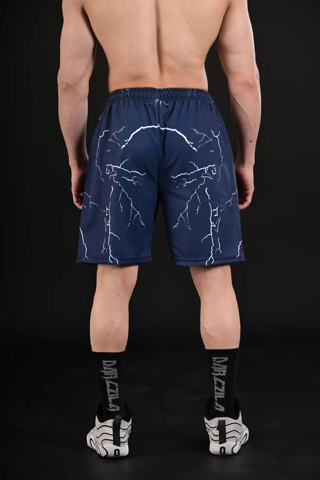 Close-up of White Lightning Print on Navy Gym Shorts
